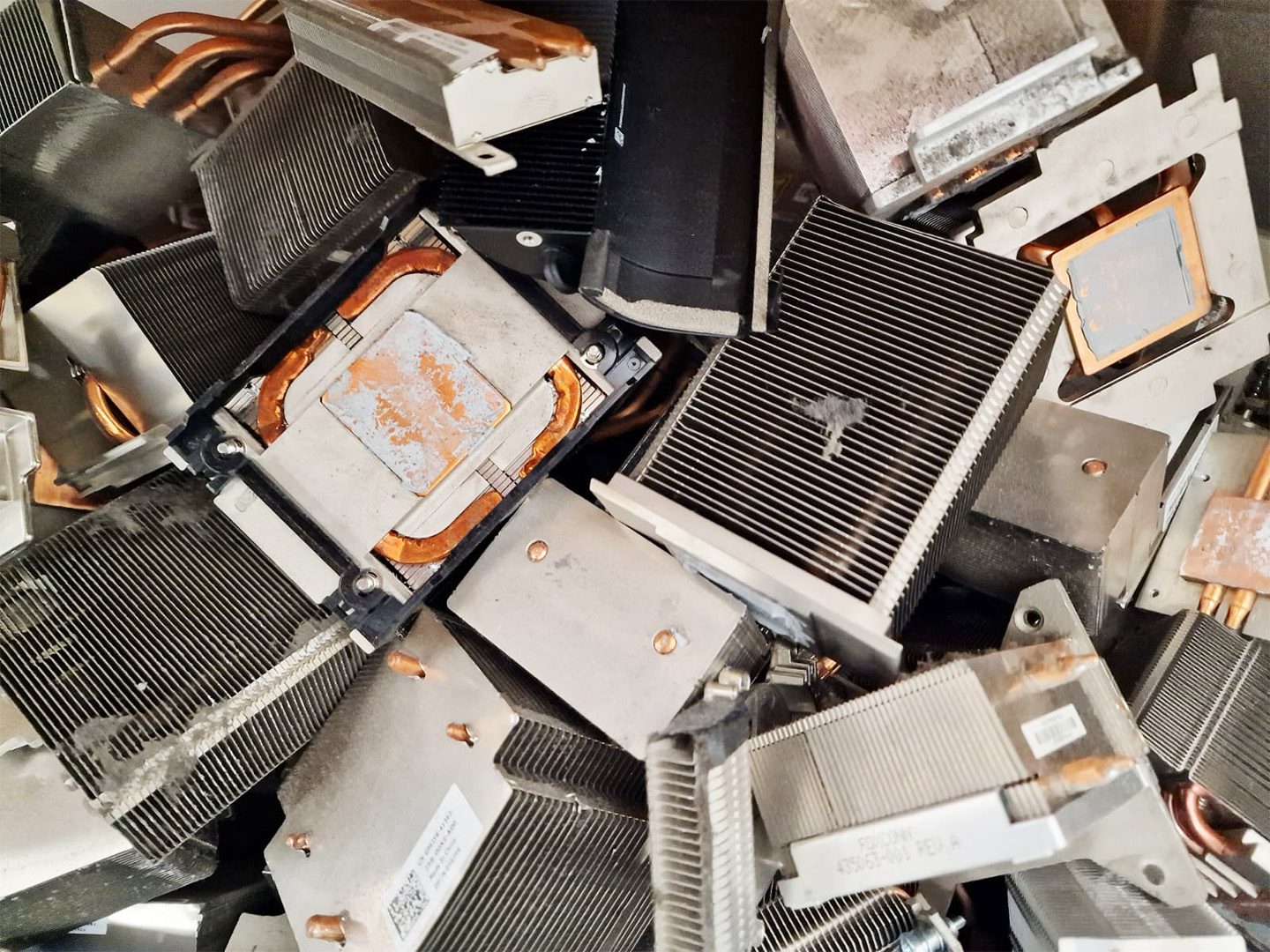 A pile of computer parts that are all broken up.